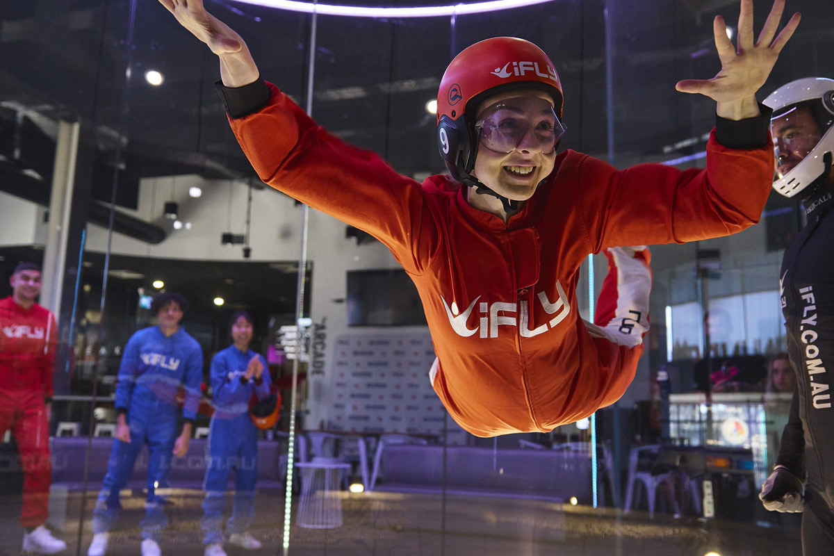 Young woman indoor sky diving at iFLY Penrith.